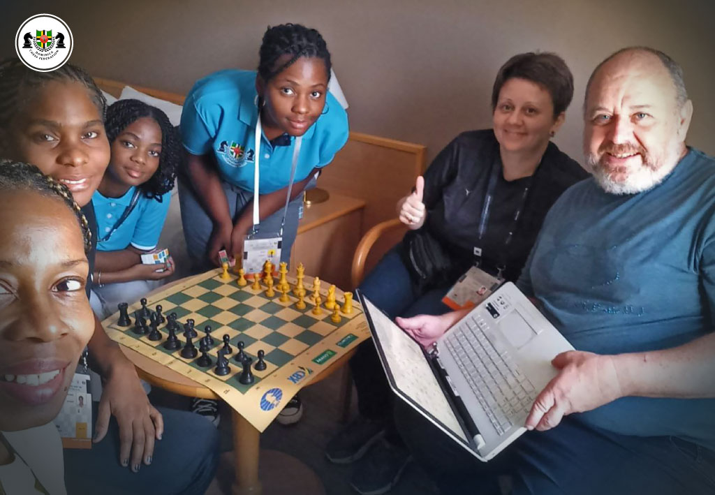 Women’s Dominica Team during a training session with Grandmaster Alejandro Hoffman at the 45th Chess Olympiad in Budapest, honing their skills for the prestigious event.